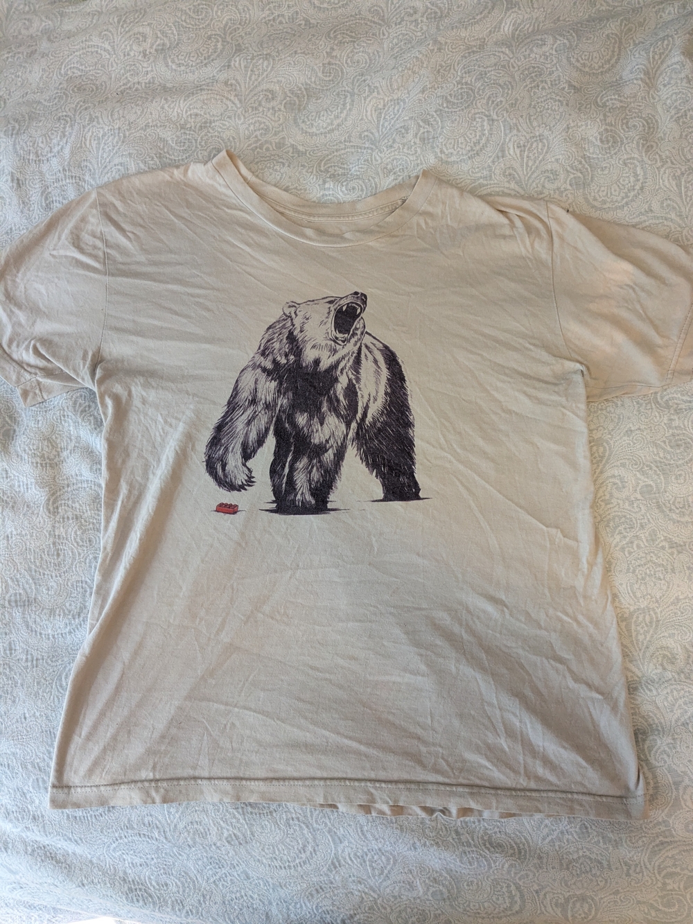 Cream Short Sleeve Bear Stepping On Lego Graphic Tee